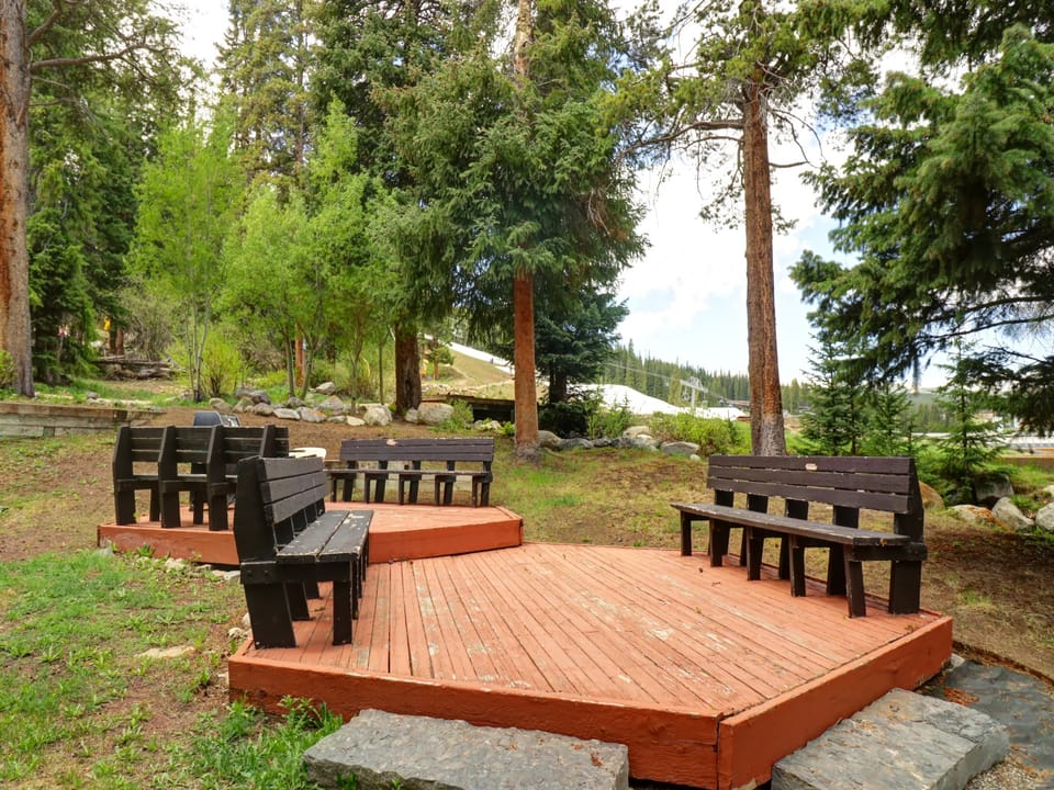 Deck area with bench seating and grill.