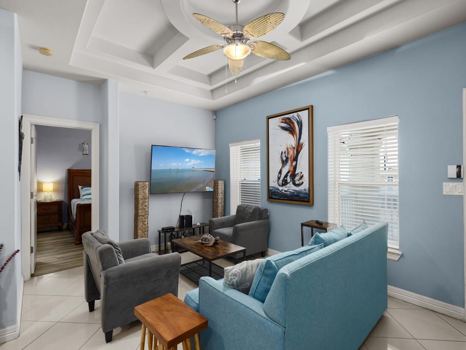 Comfortable Living Area surrounding flat screen TV