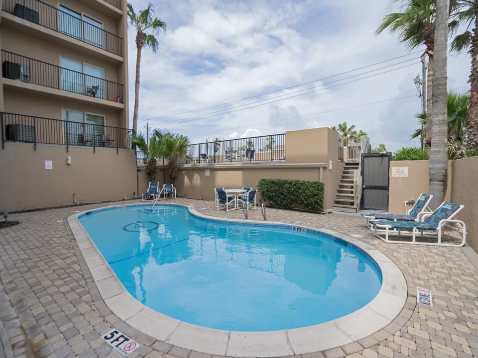 Spend sunny afternoons relaxing by the pool or soaking in the hot tub after a beach day.