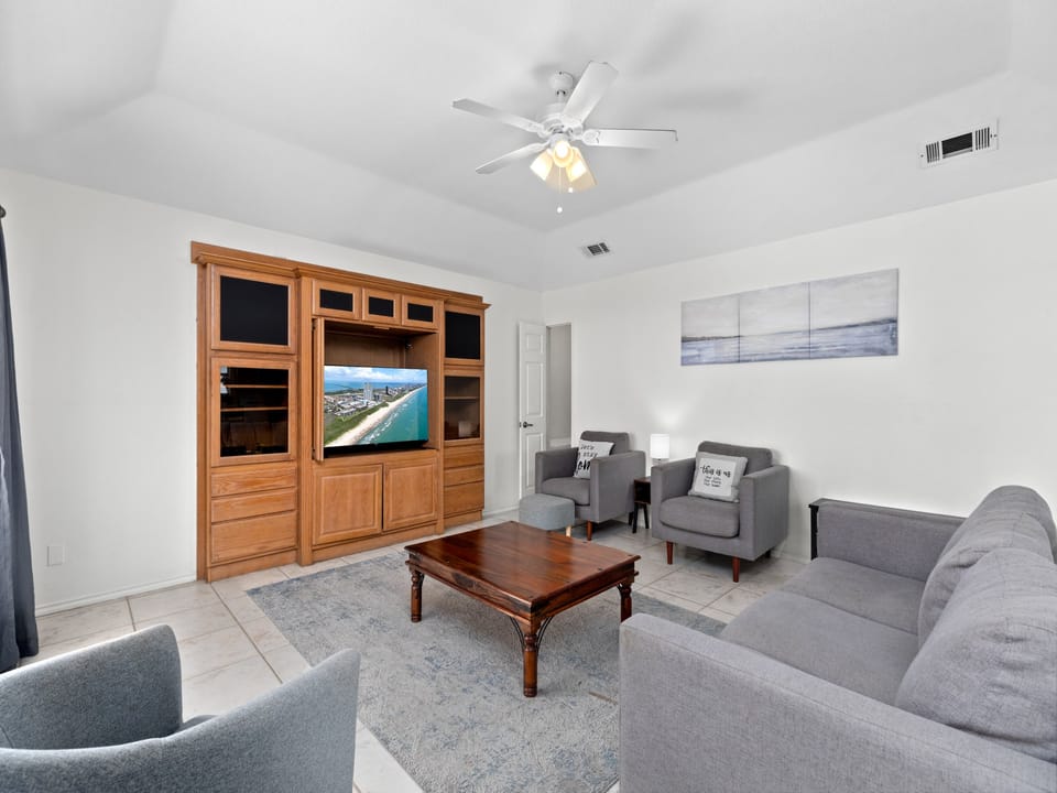 Spacious Living area surrounding flat screen TV