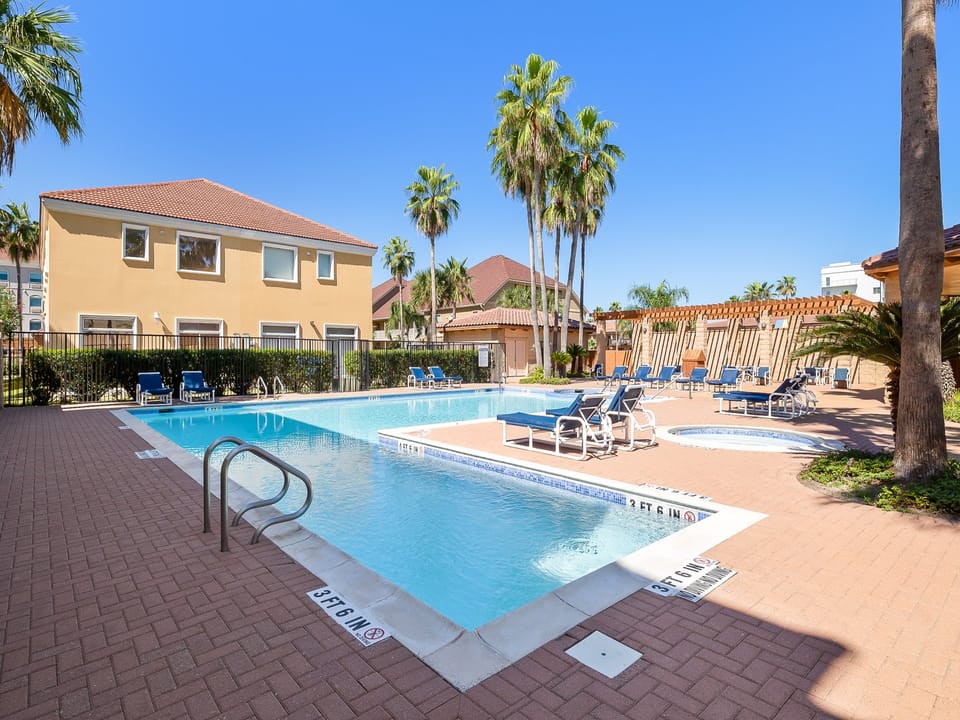 Large community pool with lounge chairs that get plenty of sun during the day!