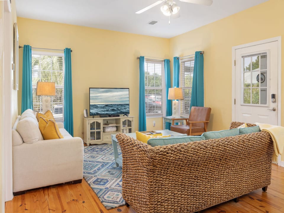 This cute cottage provides the perfect living area for relaxing in your down time. Plenty of seating is featured with a television for entertainment.