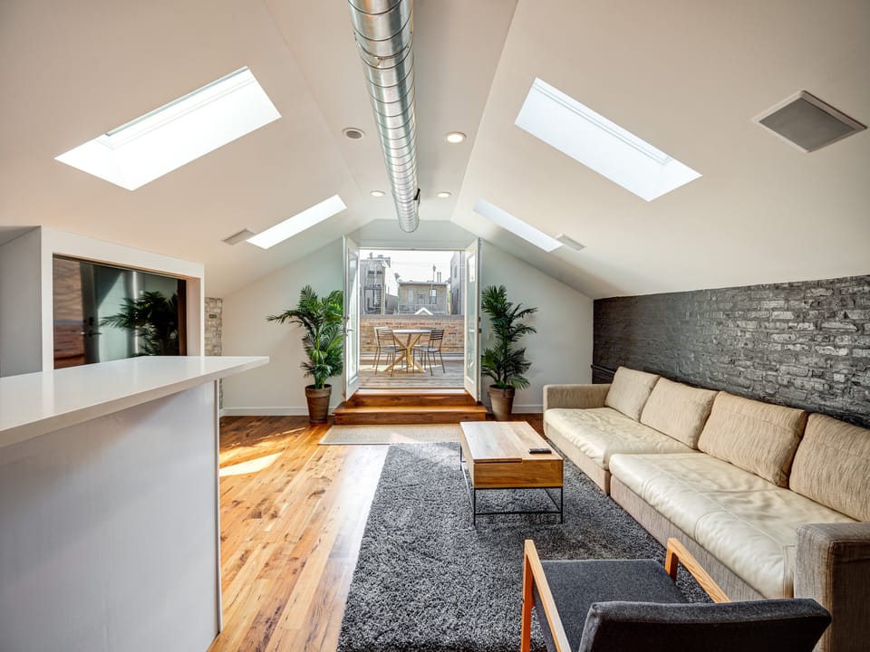 Upstairs living room with direct access to your private roofdeck