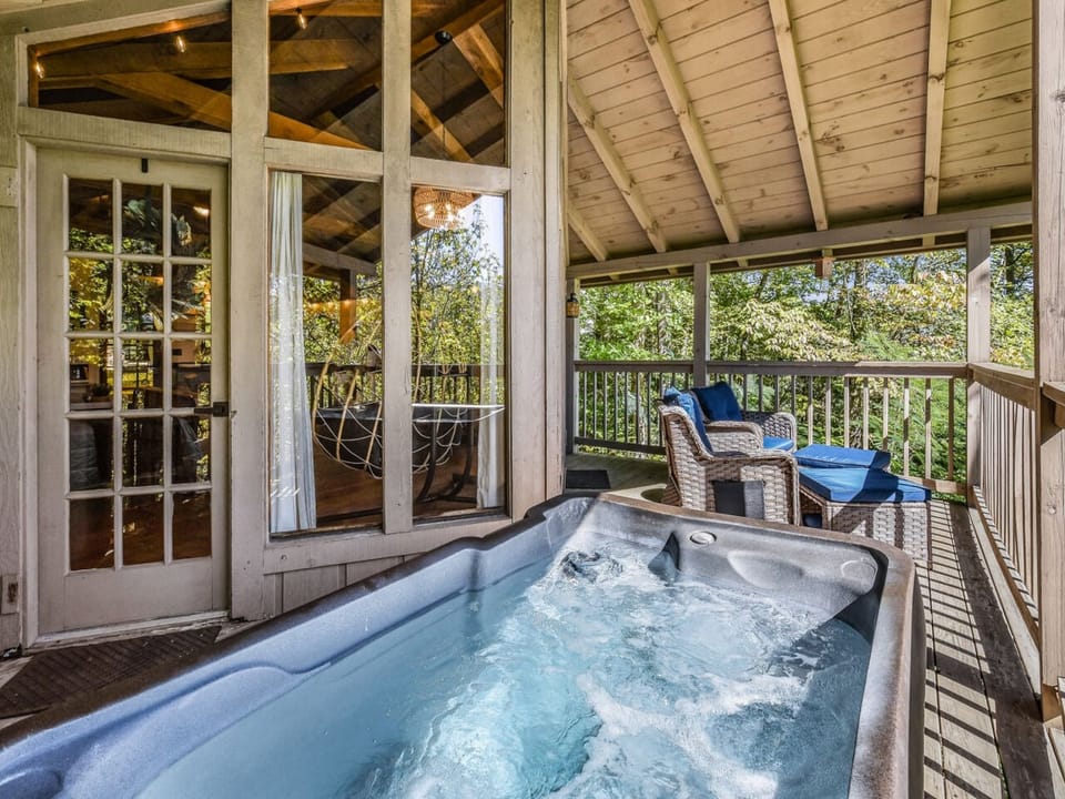 Relax in the private outdoor hot tub on the back deck. Nestled in a serene wooded setting, this is the perfect spot to unwind under the stars after hiking the Smokies