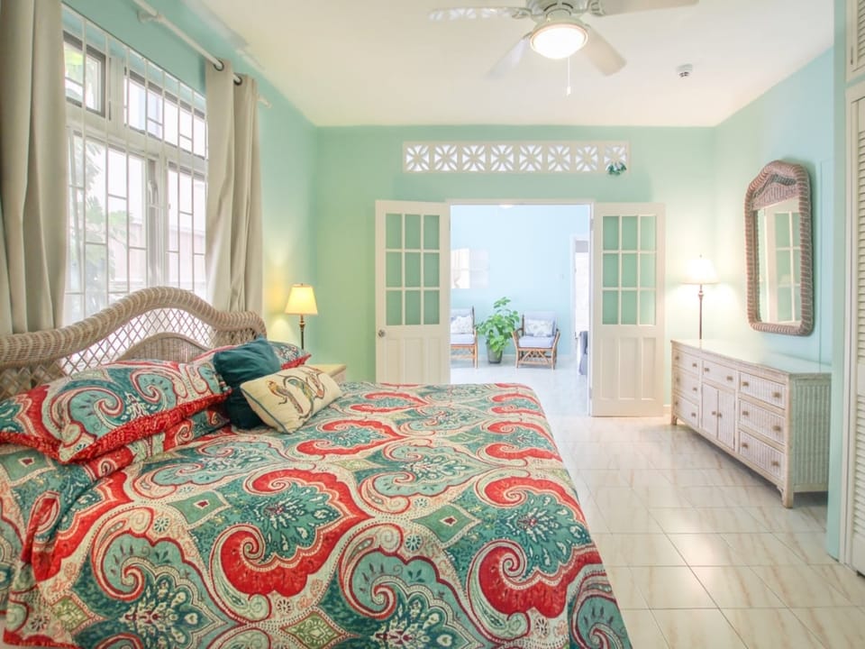 Spacious master bedroom with air-conditioning and king bed