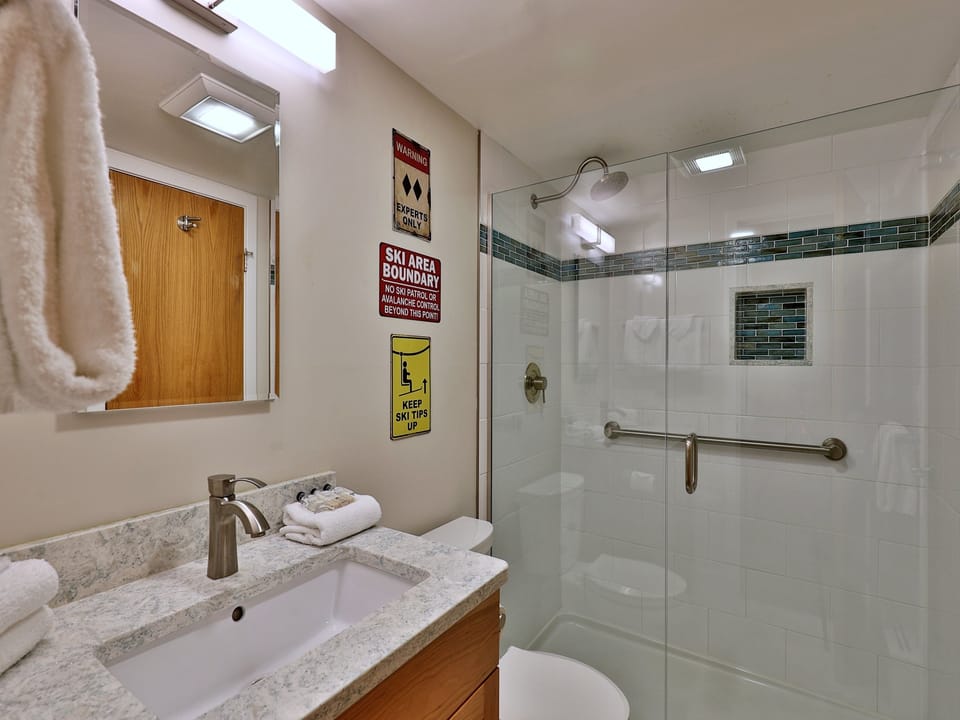 Tile and glass shower in bathroom