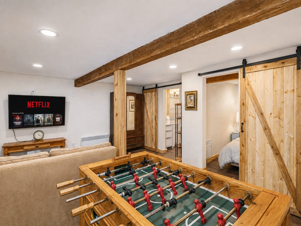 Lower Level Space with Foosball, TV with streaming, bathroom with shower and washer and dryer.