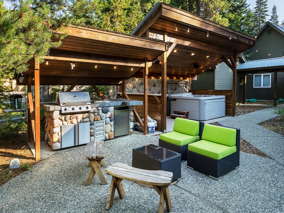 Patio with covered propane grill and covered hot tub
