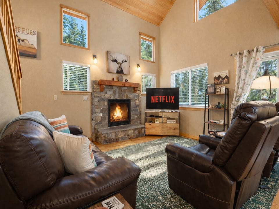 Living room with cozy gas fireplace and streaming TV.