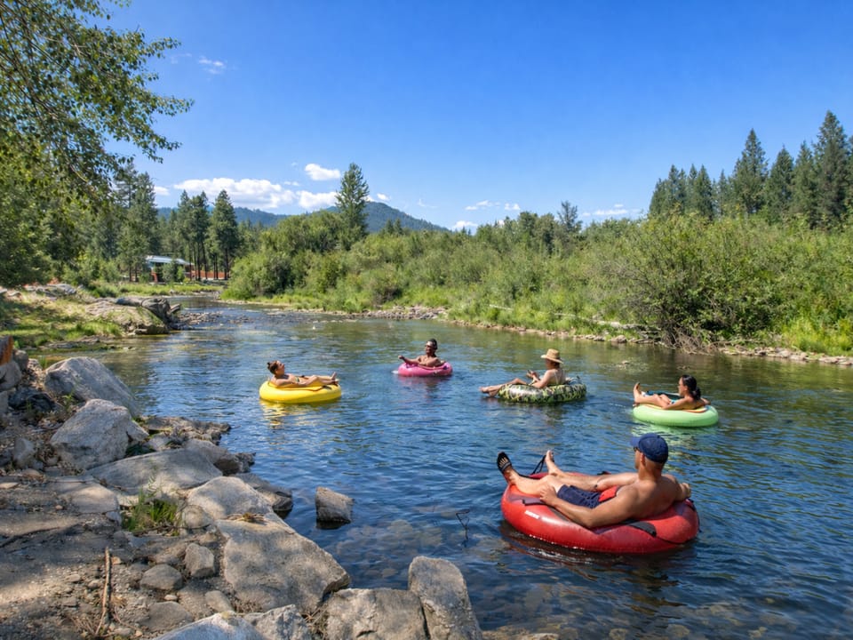 The Wenatchee river flows through pristine wilderness, surrounded by lush forests.