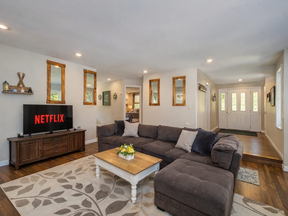 Sink into this plush sectional sofa and enjoy movie nights on the large TV in your cozy living space.