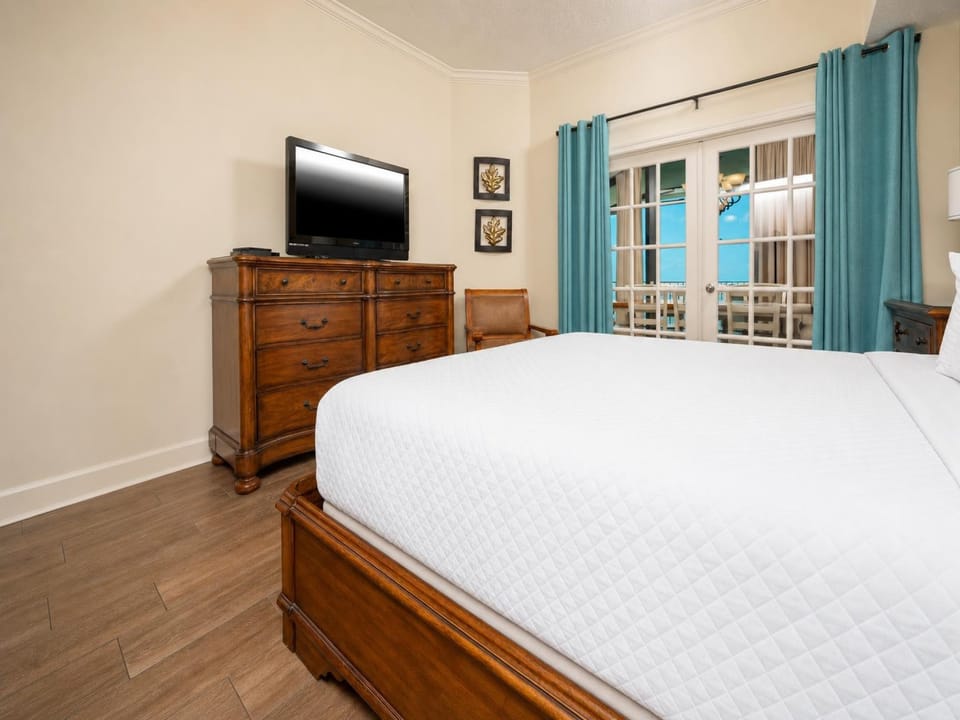 Relax after a fun beach day and enjoy a movie from the cozy king bed in the master suite