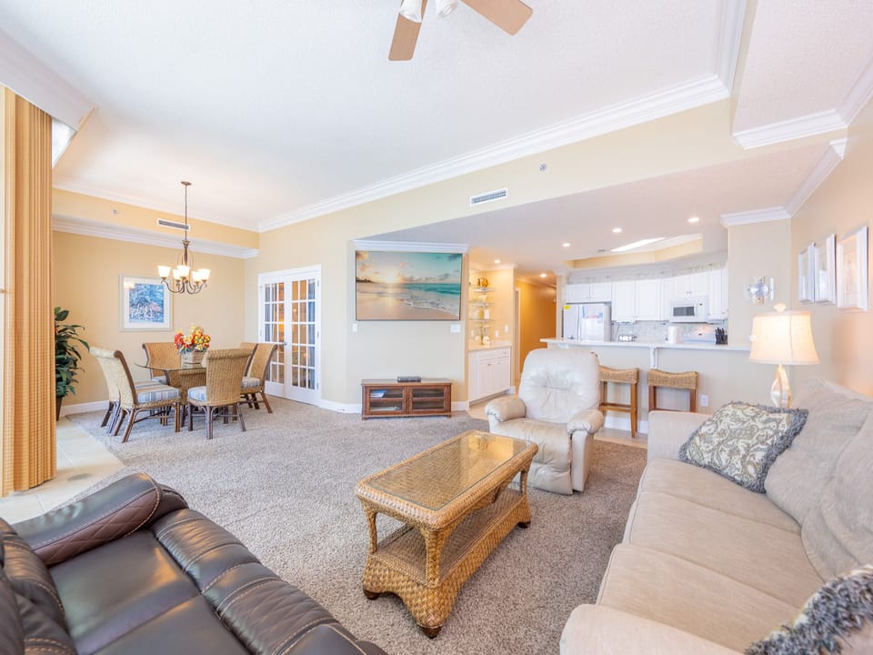Relax in the living area with a queen sofa sleeper, perfect for enjoying a movie or sharing stories after a day at the beach