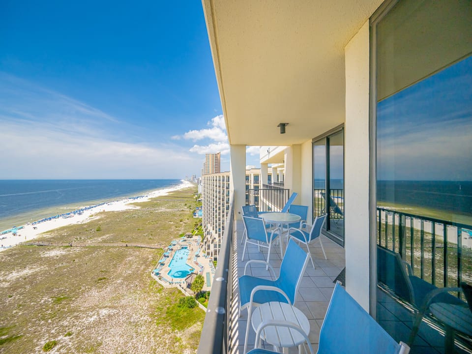 Balcony seating offers a serene spot to enjoy views of the sparkling gulf and the inviting beach below