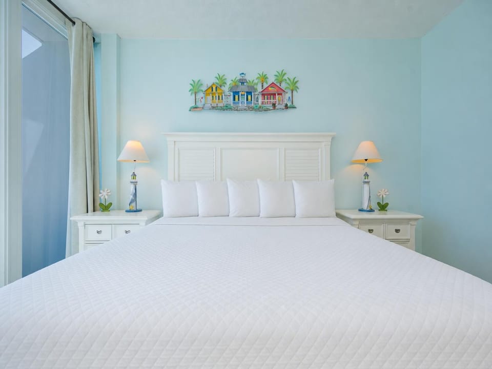 Cool coastal tones surround the king bed in the suite as you settle in for a restful night's sleep