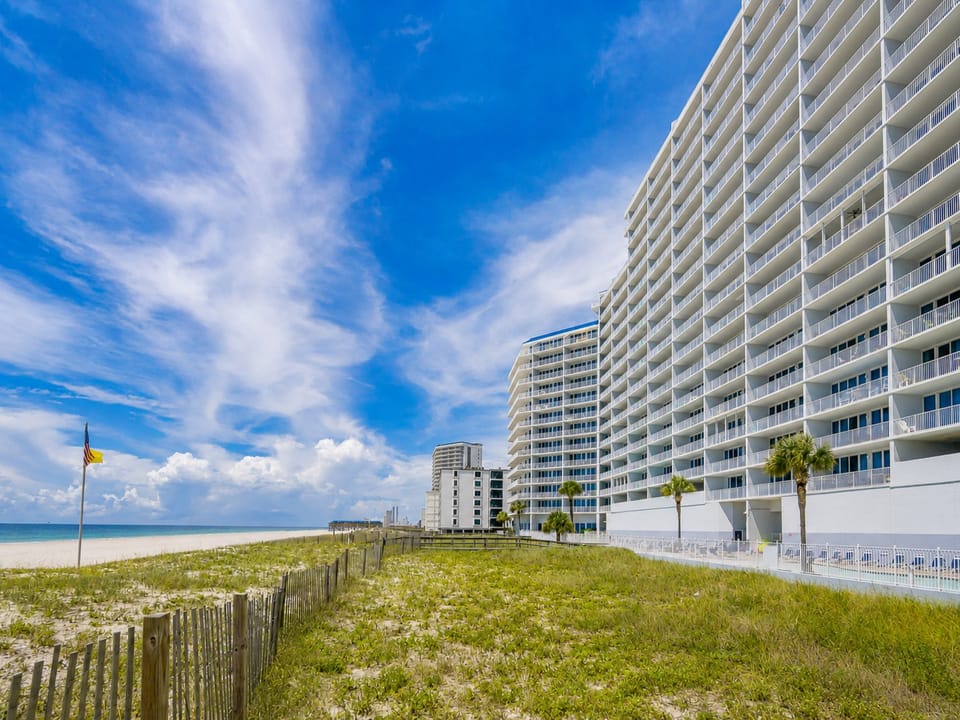 Experience the stunning beachfront views and modern amenities of The Lighthouse in Gulf Shores