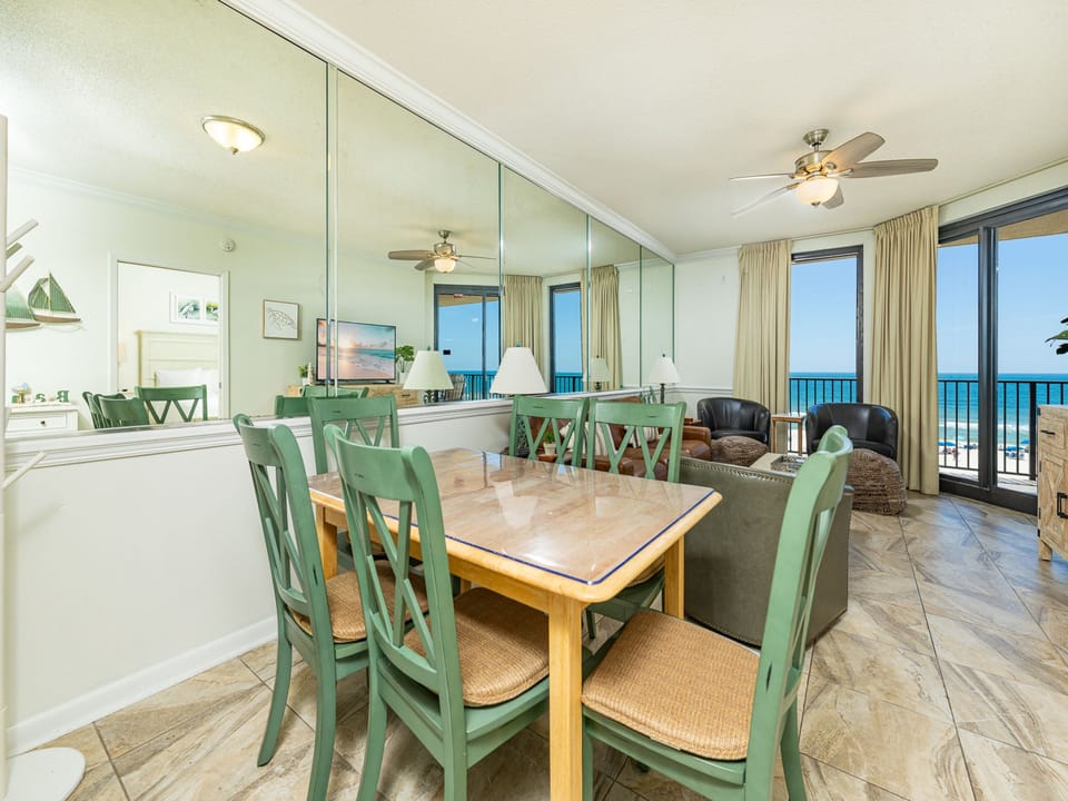 Gather around the dining table for meals while enjoying the inviting atmosphere and beach views through large windows