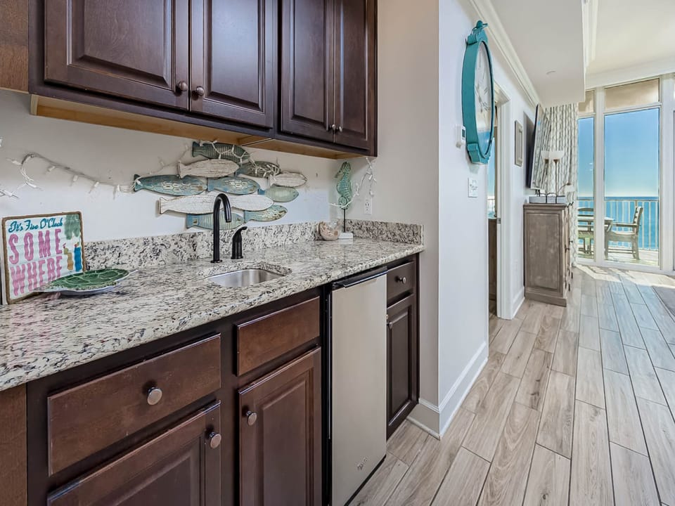 Your fully equipped kitchen flows seamlessly toward breathtaking ocean views, perfect for morning coffee with spectacular sea vistas.