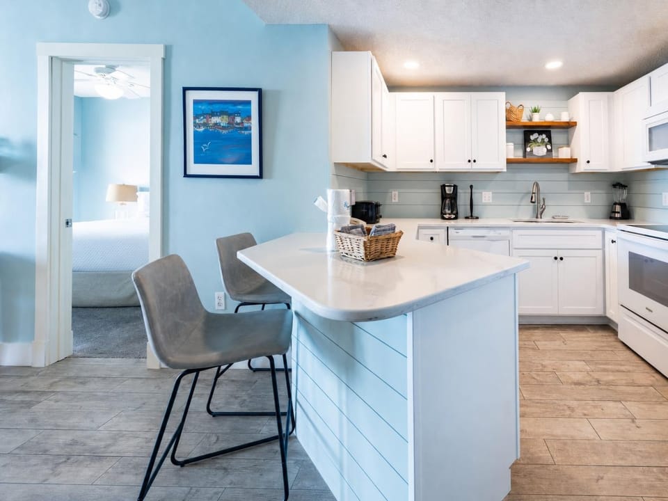 Enjoy the open layout with a sleek kitchen and inviting dining space, perfect for meals and gatherings
