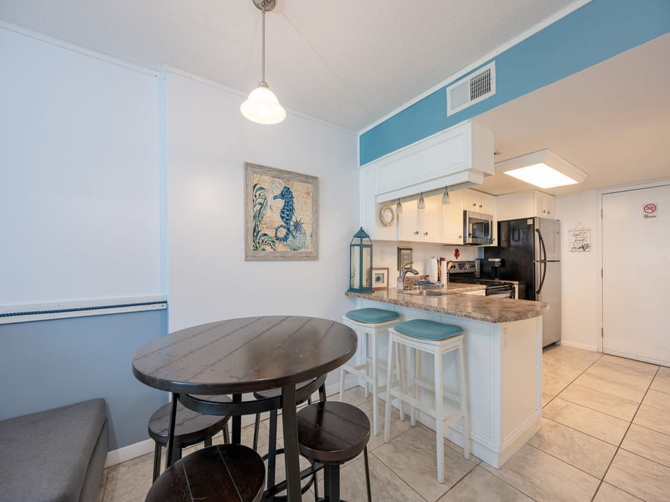 Gather around the cozy table to enjoy laughter and stories, while basking in beach decor