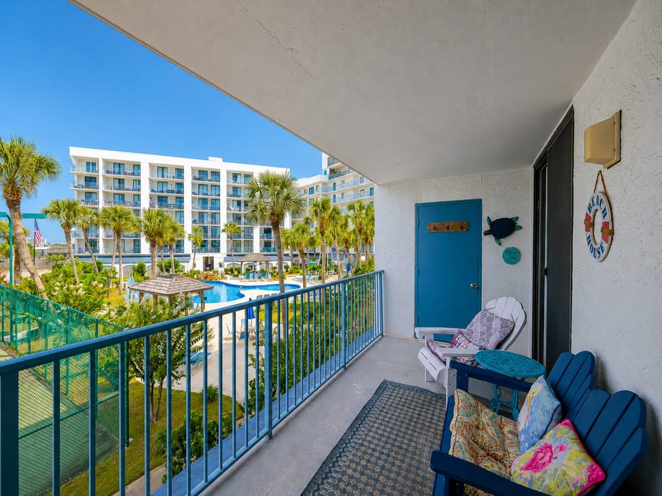Relax on your balcony as you soak in the vibrant coastal views and enjoy the serene poolside vibes below