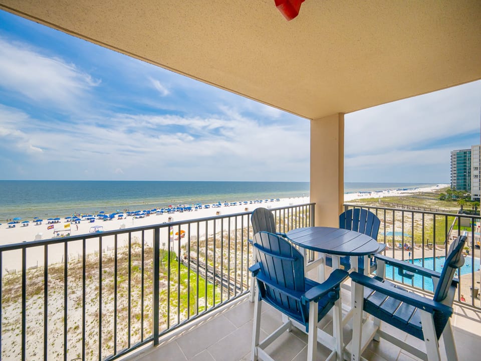 Savor your morning coffee at the table while enjoying sweeping views of the beach and vibrant blue skies