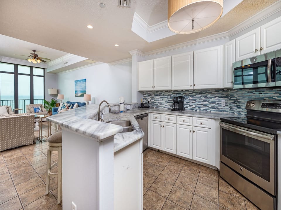 Prepare your favorite recipes in this inviting kitchen, enjoying warm vibes as you mix and mingle with loved ones