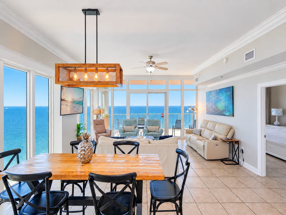 Gather around the rustic dining table with panoramic views, while enjoying the comfortable seating and modern decor