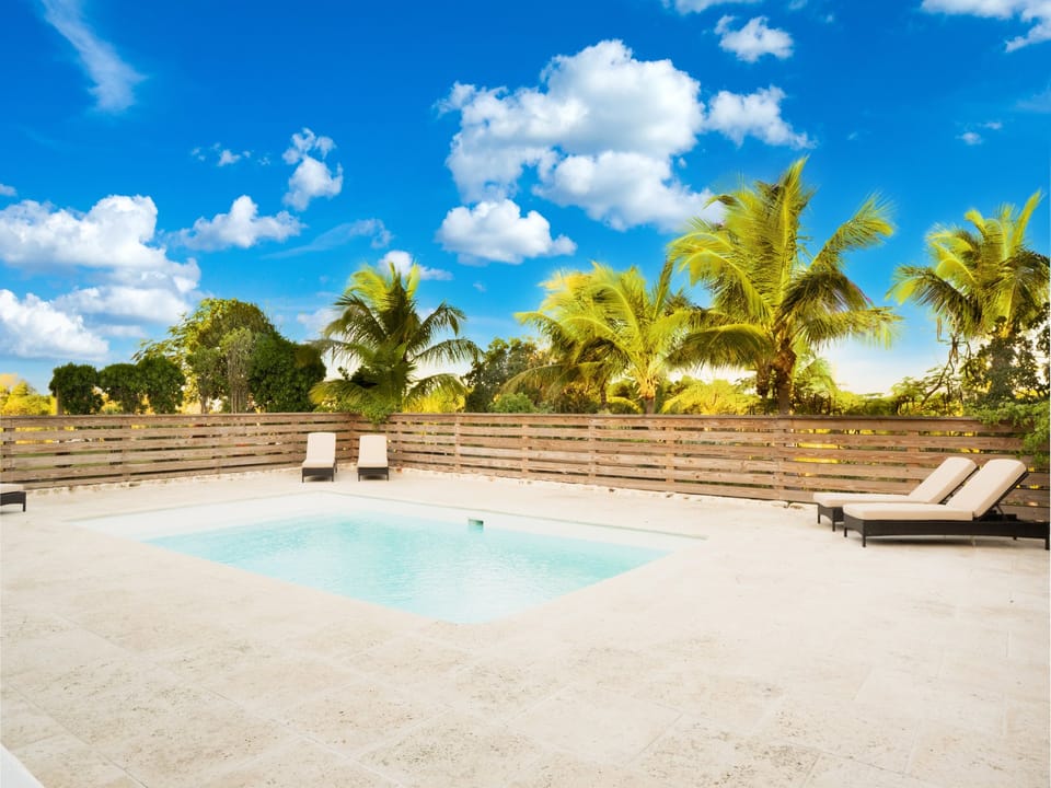 Our new heated private pool and expansive deck with lounge chairs!
