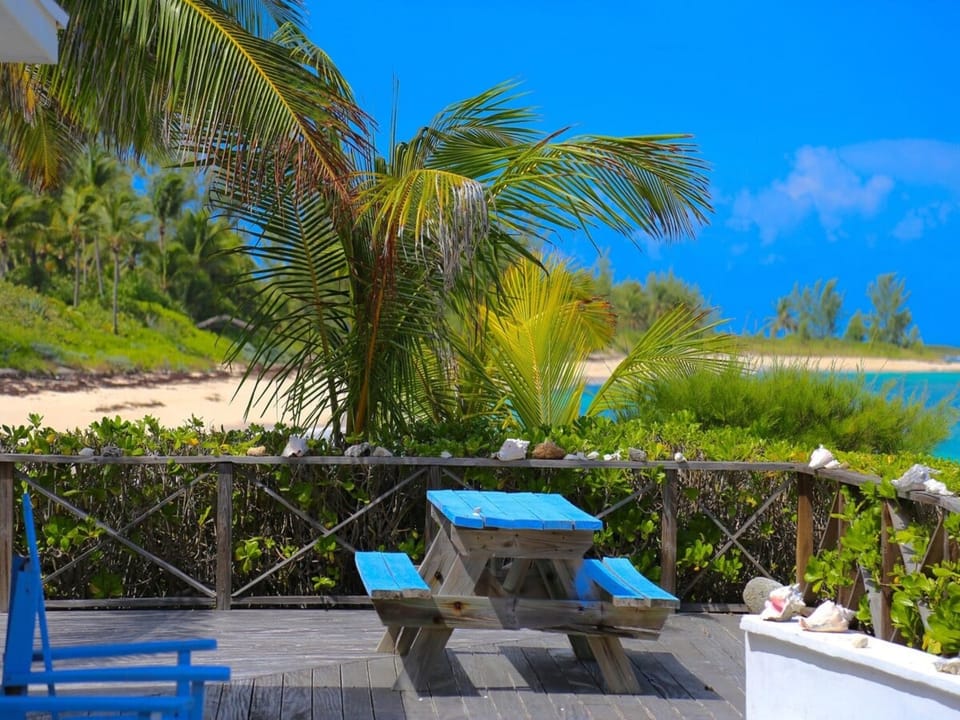 Med Point's 1200 square foot teak deck with our deserted beach in the background.