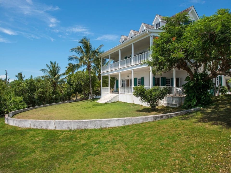 Wrap around verandas with harbor views overlooking the large lawns.
