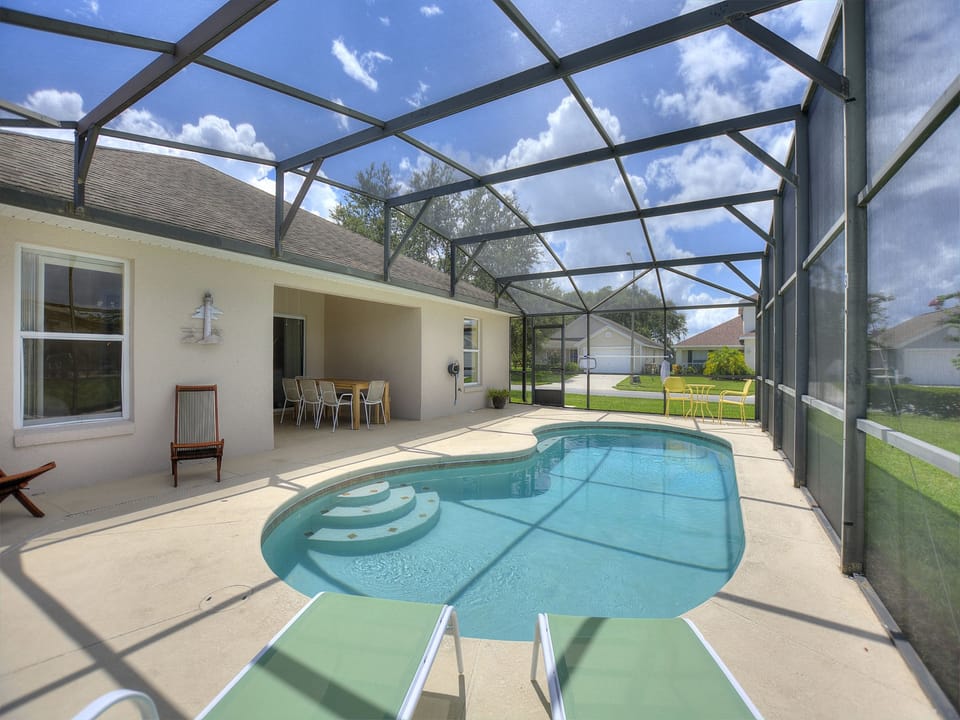Private swimming pool with outdoor loungers