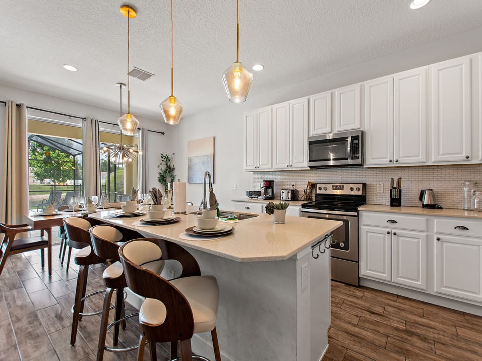 Fully-furnished kitchen with counter bar