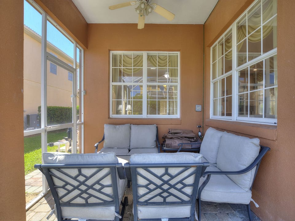 Covered patio seating area at Sunset Corner Retreat by Shine Villas