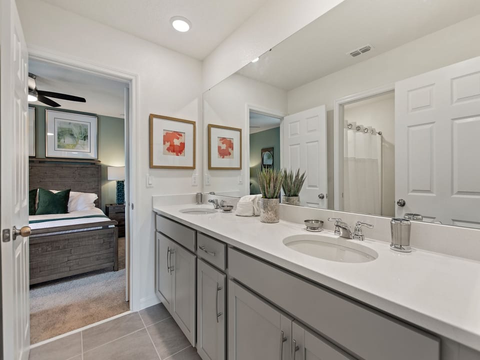 Adjacent bathroom with shower over bath