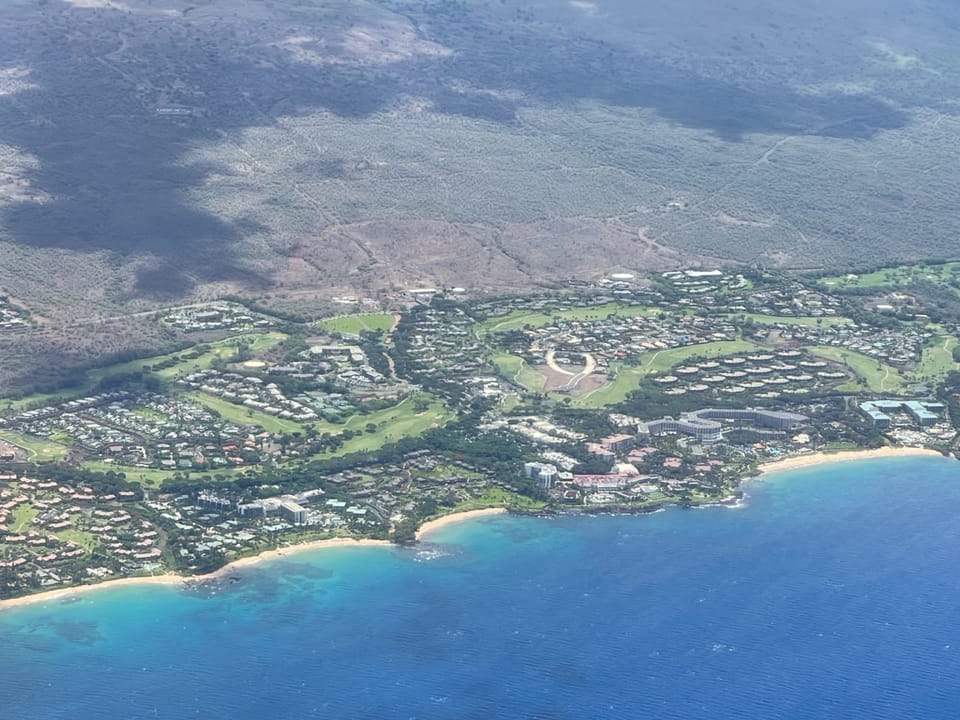 Ulua Beach is the 1st sandy cove left of the center peninsula