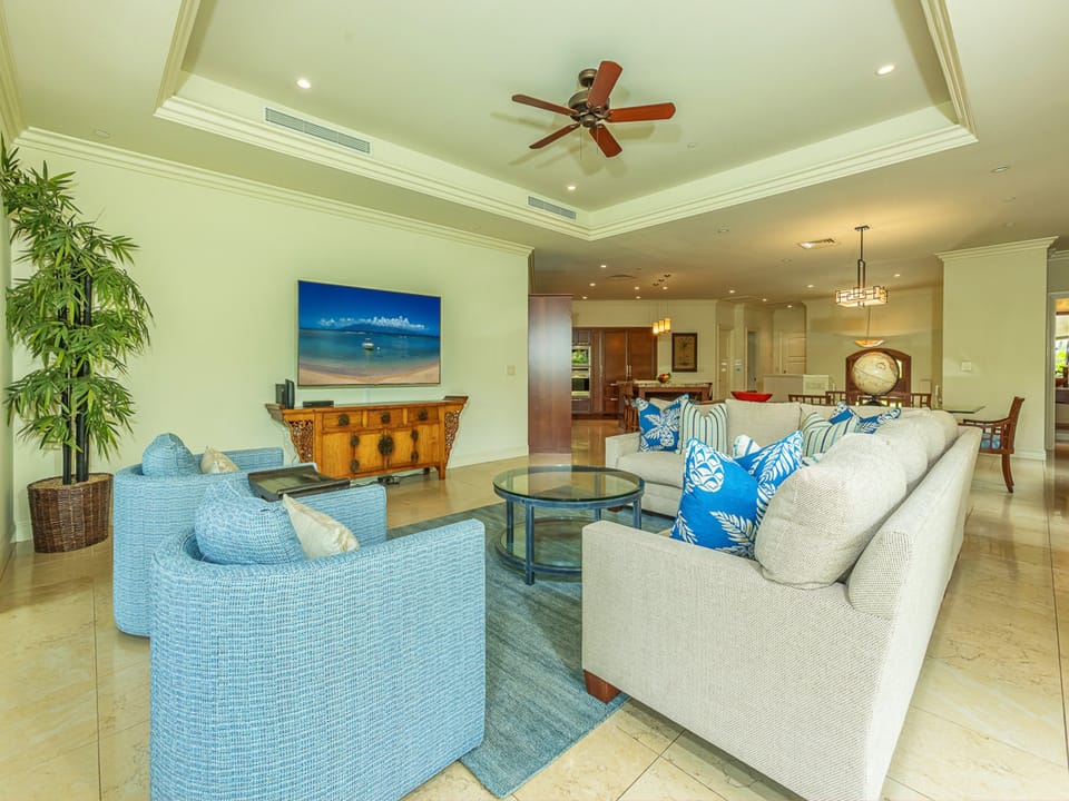 Sink into coastal comfort in this breezy living space, where plush seating and tropical accents invite you to unwind after sun-soaked island days.