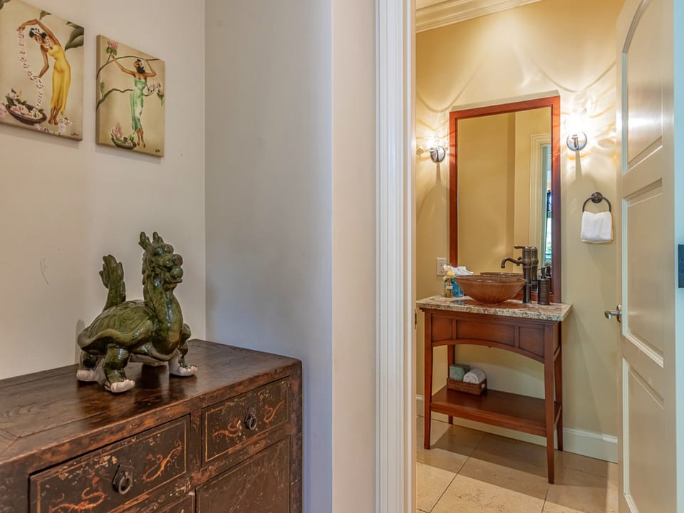Peek into your private retreat where handcrafted details meet calming elegance. The vessel sink and granite countertop invite you to unwind after a day exploring.