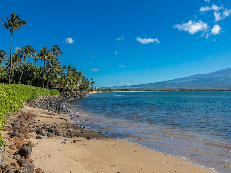 Sandy beach access just beyond your lanai