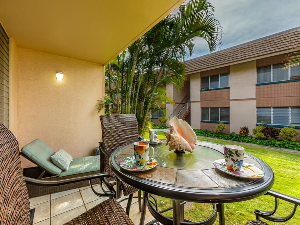 Dining for three on the lanai and a lounger to relax