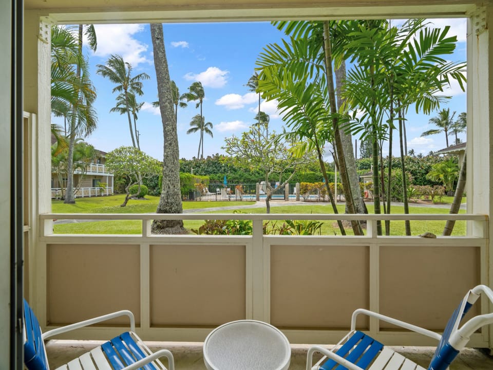 Sip morning coffee on your private patio and gaze out at swaying palms, manicured greens, and the sparkling pool beyond a tropical escape waiting just outside your door.