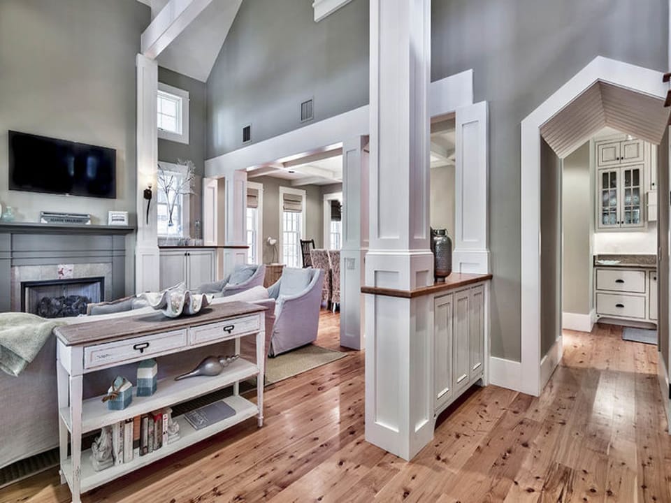 You are welcomed into the home with warm and inviting tones and unique architectural door ways
