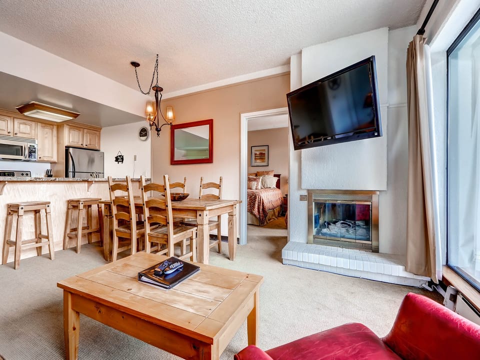 Open living dining kitchen large screen TV cozy gas fireplace - Park City Lodging-113 Edelweiss