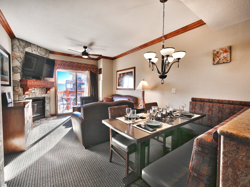 Dining area with L shaped dining nook bench overlooking the living room