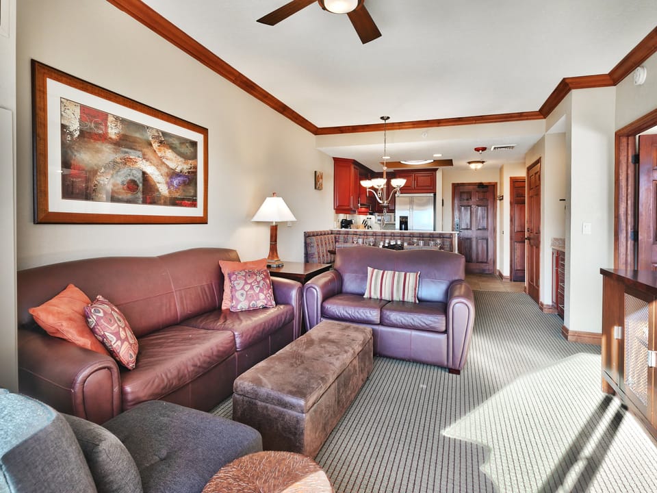Comfortable living room seating with red leather sofa and love seat and accent chair