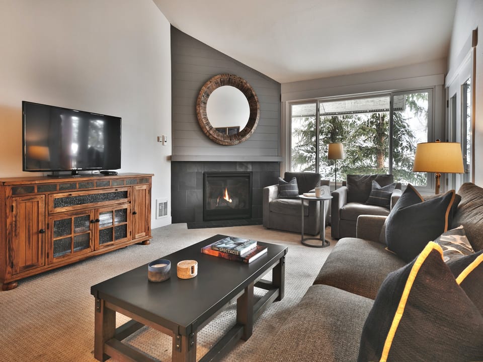 Comfortable seating in the living room with a gas fireplace