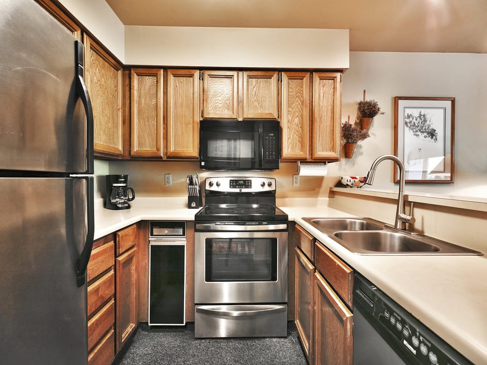 Kitchen is fully equipped and includes stainless-steel appliances