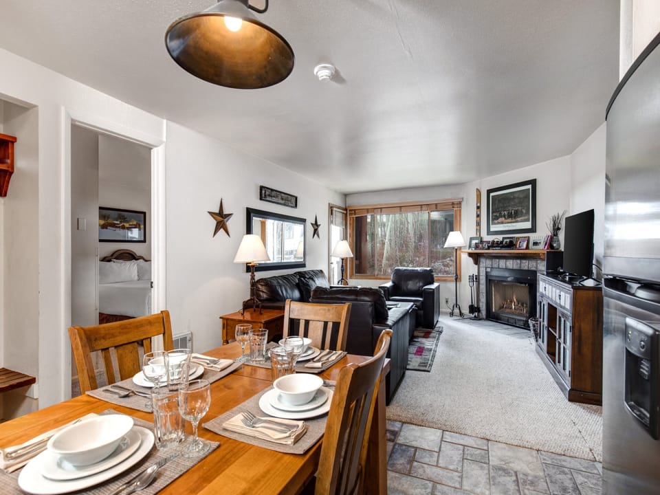 Snow Flower 65's dining area has seating for 6 with place settings, and offers an open concept flowing into the living room.
