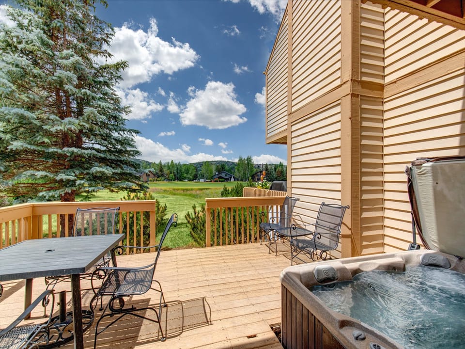 The private hot tub and private outdoor deck overlooking the golf greens and lake.