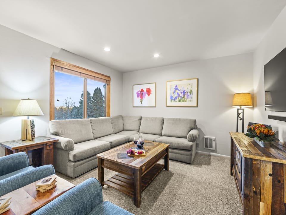 Snowflower 41 offers a spacious living area with a large sectional sofa.